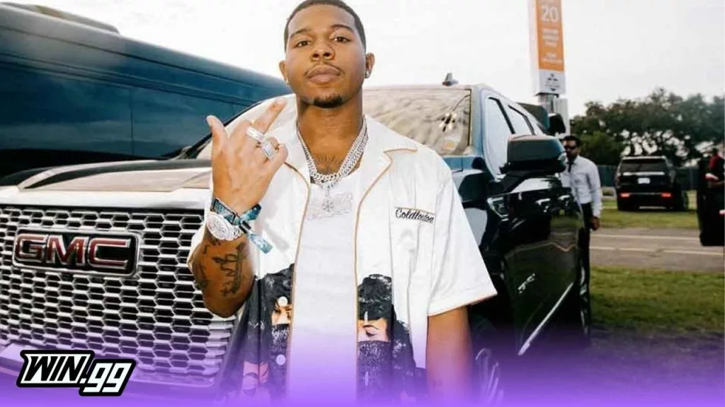 DeshaeFrost posing in front of a car